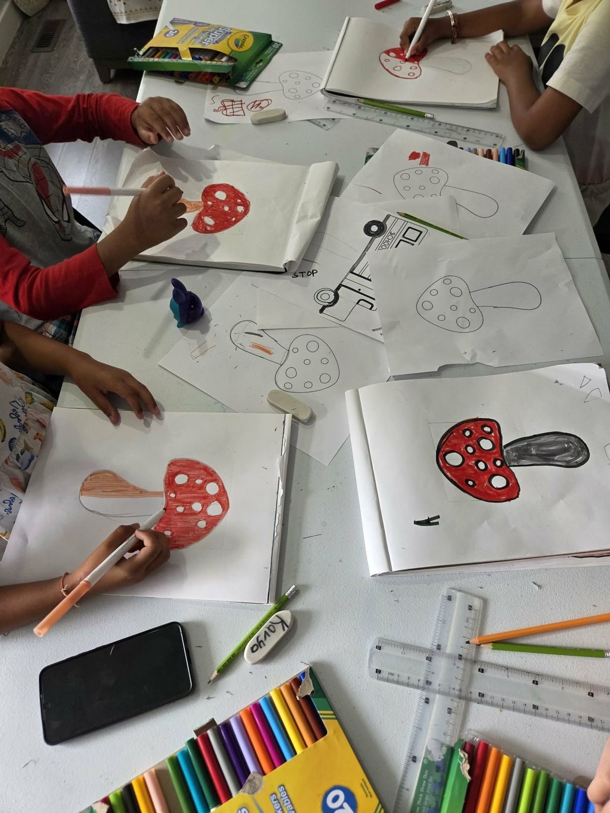 Students drawing and coloring mushroom illustrations
