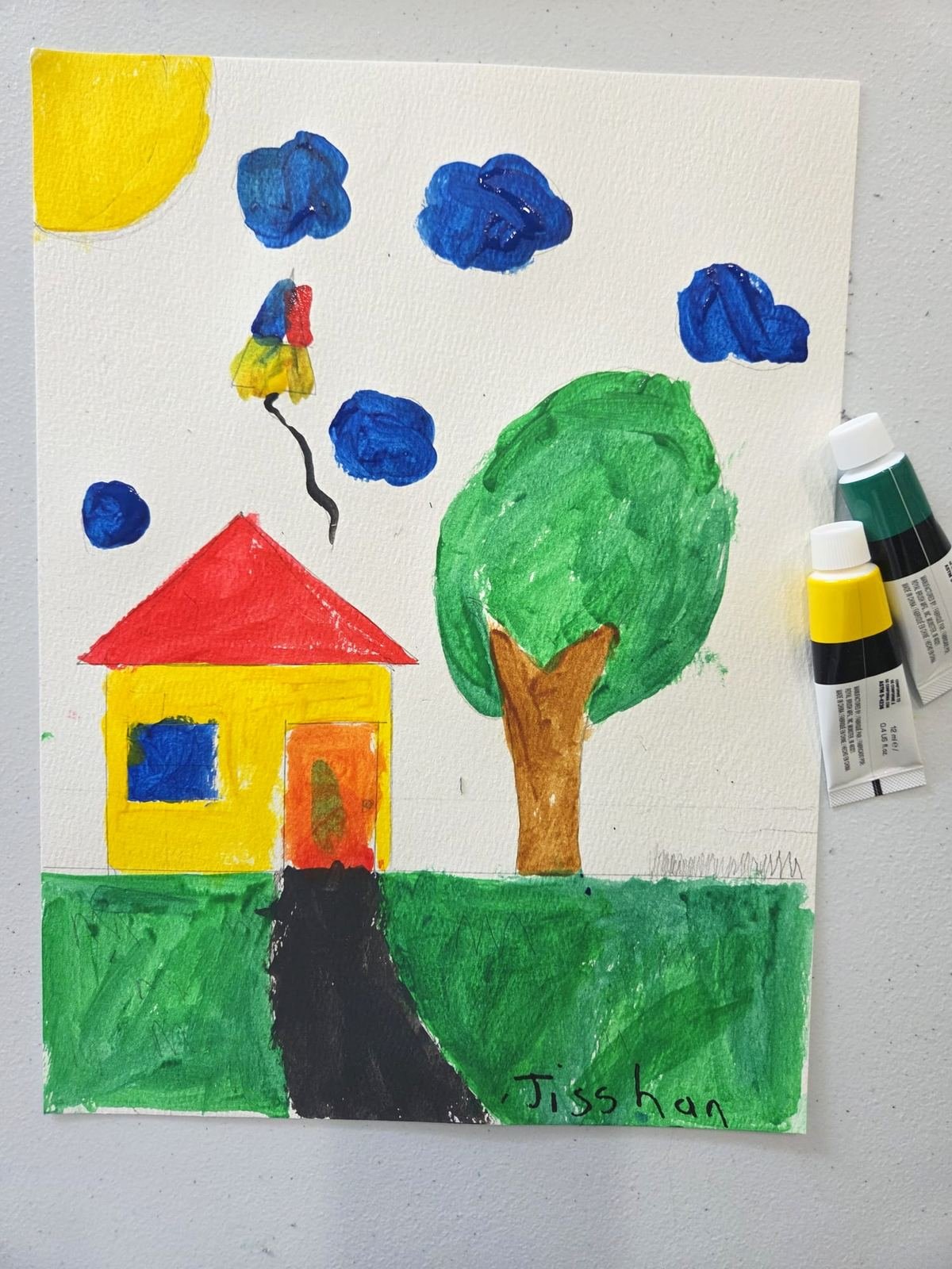 Student painting of a house and tree, signed Aysha